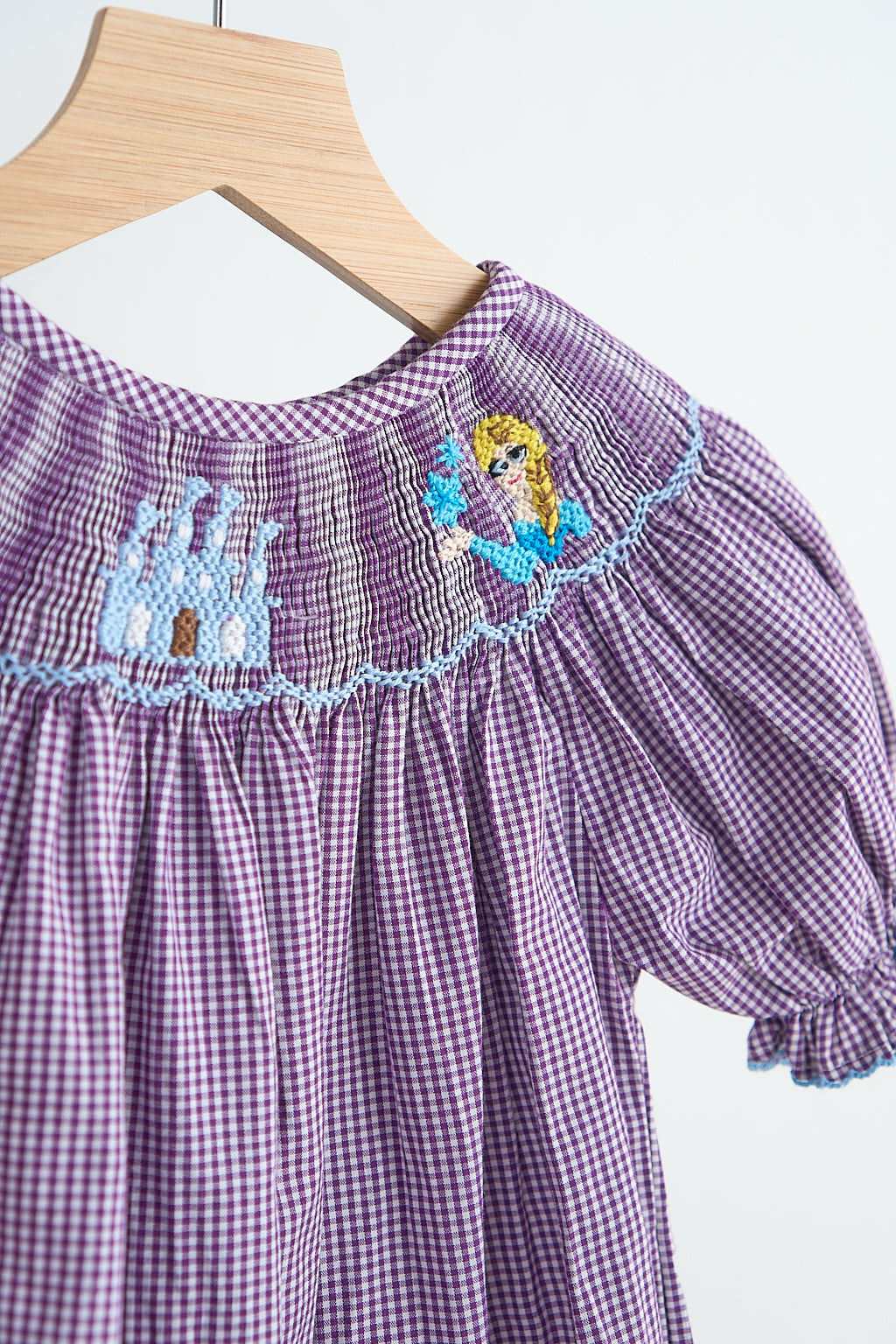 Purple castle hand smocked gingham girl romper