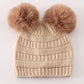 Beige double pompom cable beanie