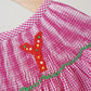 Pink christmas joy hand smocked gingham dress