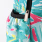 Green lily print backpack bag